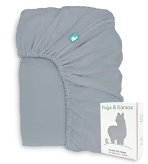 Hugs & Llamas organic muslin crib sheet in Neutral Moonlit Lake offers soft, breathable comfort for baby.