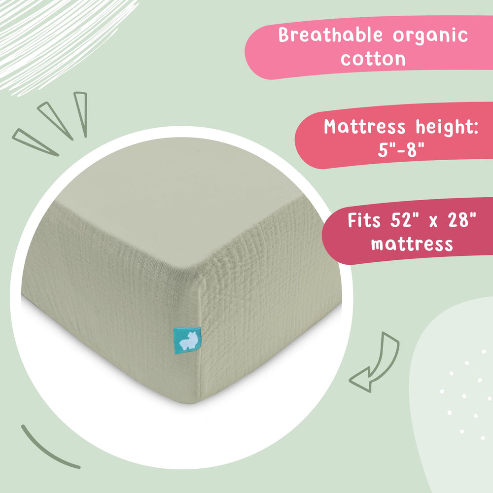 Hugs & Llamas olive muslin on a standard US crib mattress for sizing
