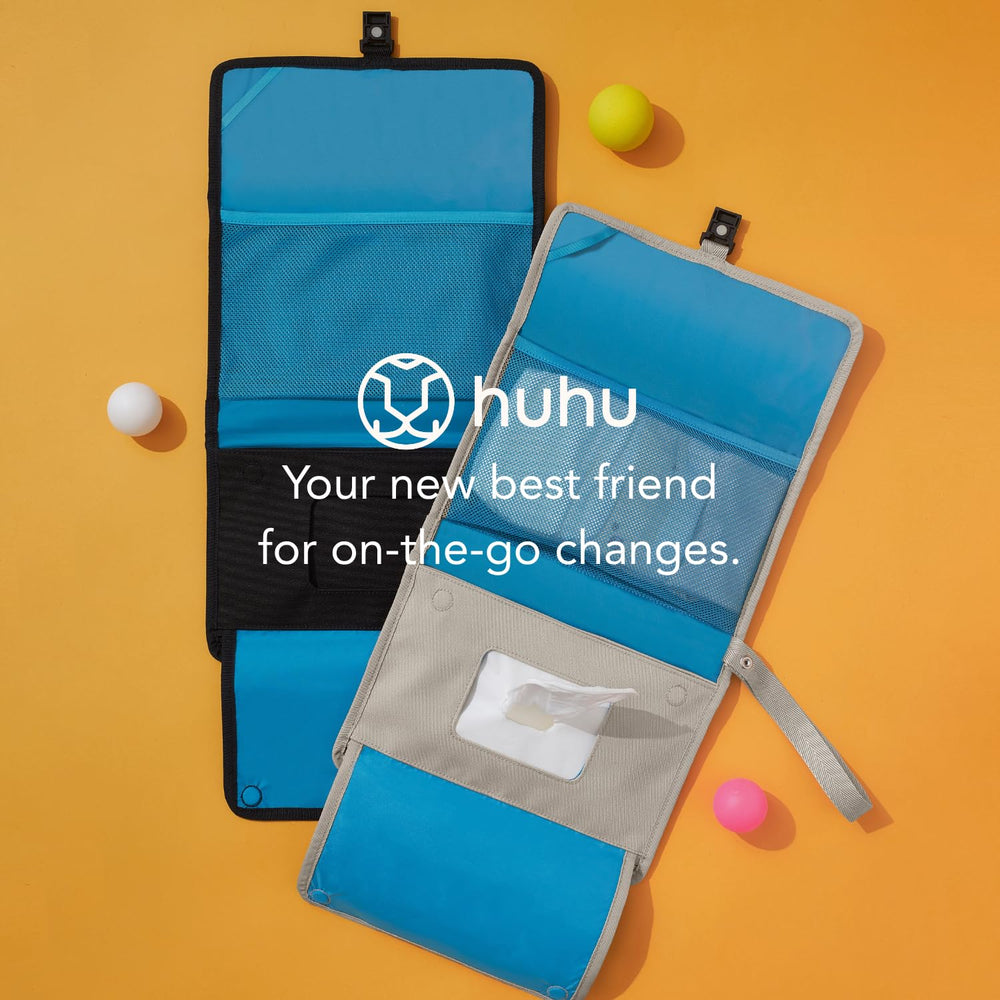 Huhu Baby Changing Wallet keeps essentials neatly organized during changes