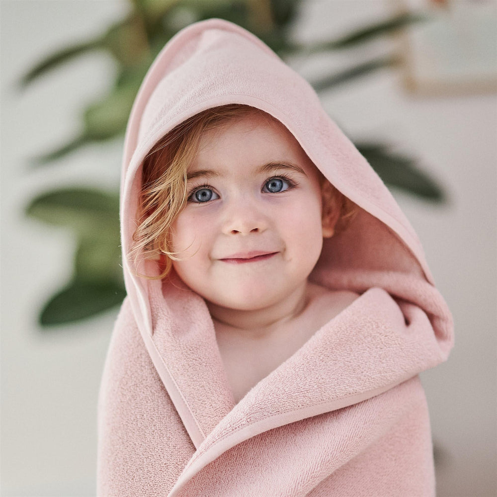 Huxie hooded towel with soft plush fibers for cozy bath time.