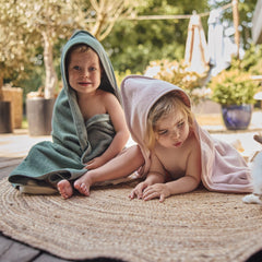 Huxie towel after bath invites secure snuggles with a warm, absorbent wrap.