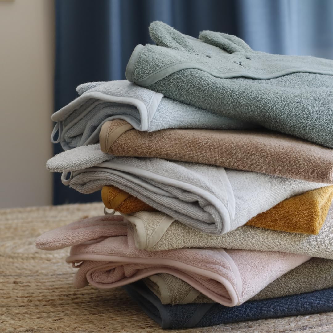 Huxie towel in soft hues resists fading with regular washing for lasting color.
