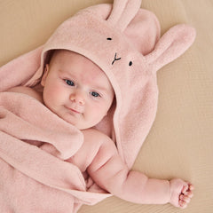 Huxie hooded towel on baby during bath time for quick drying.