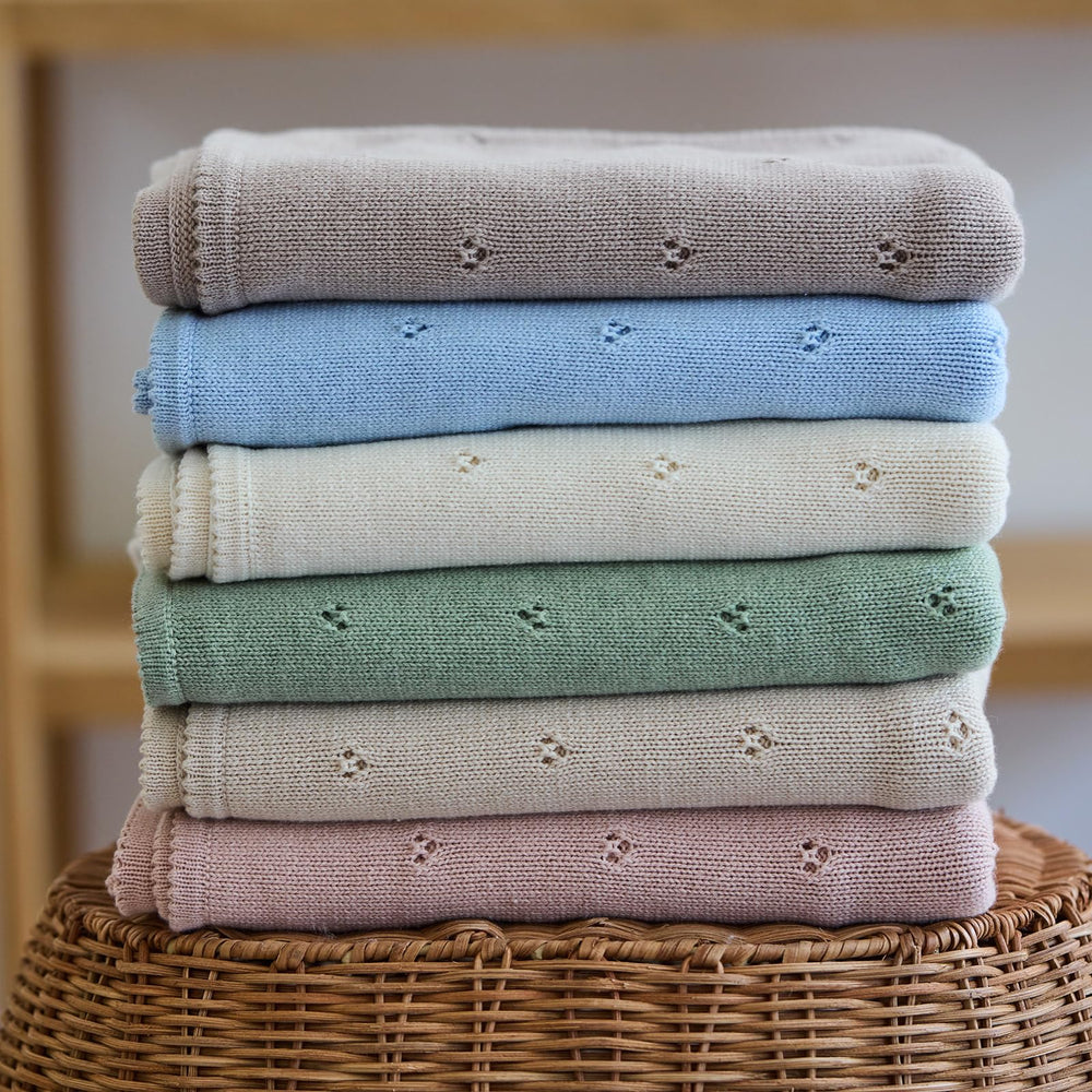 Huxie blanket being washed on gentle cycle, easy care for busy parents.
