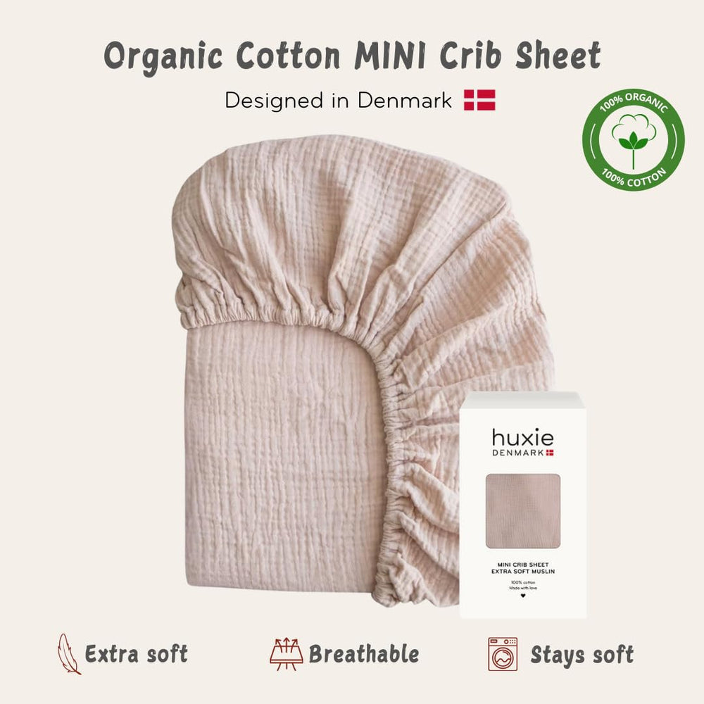 Blush color Huxie crib sheet adds gentle, gender-neutral style.