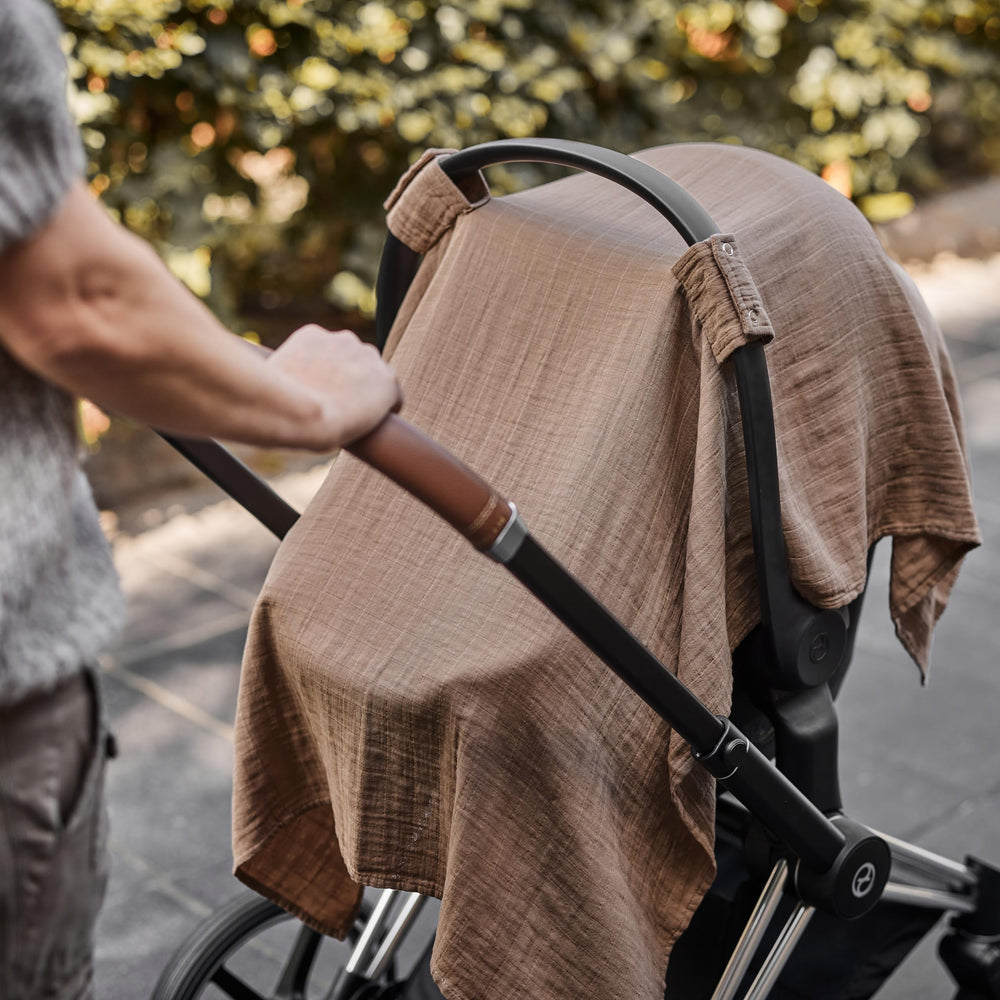 Huxie carseat cover swaddle blanket use provides soft, cozy versatility