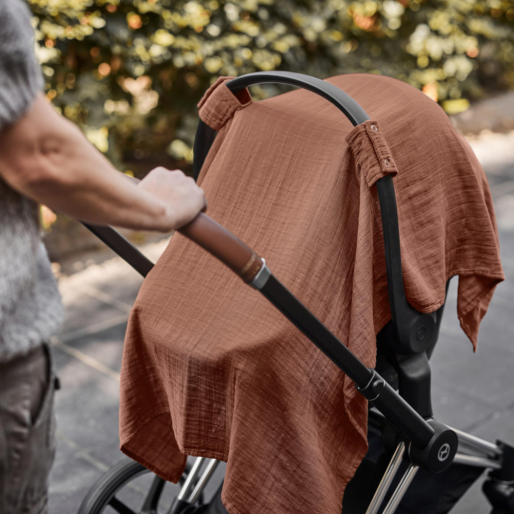 Huxie cedar color blends with nursery decor and outfits.