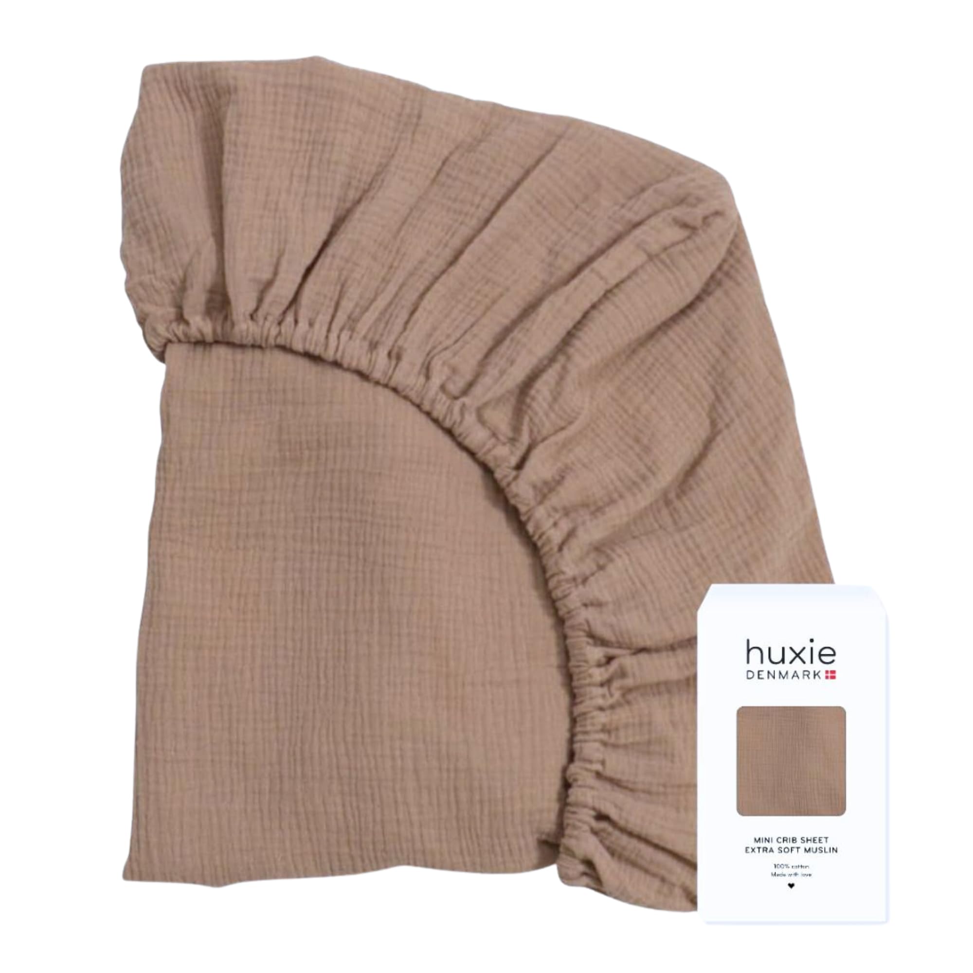 Huxie crib sheets organic cotton close-up shows a soft, breathable weave for baby comfort.