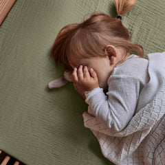 Huxie sage green close-up shows plush, breathable fabric for baby comfort.