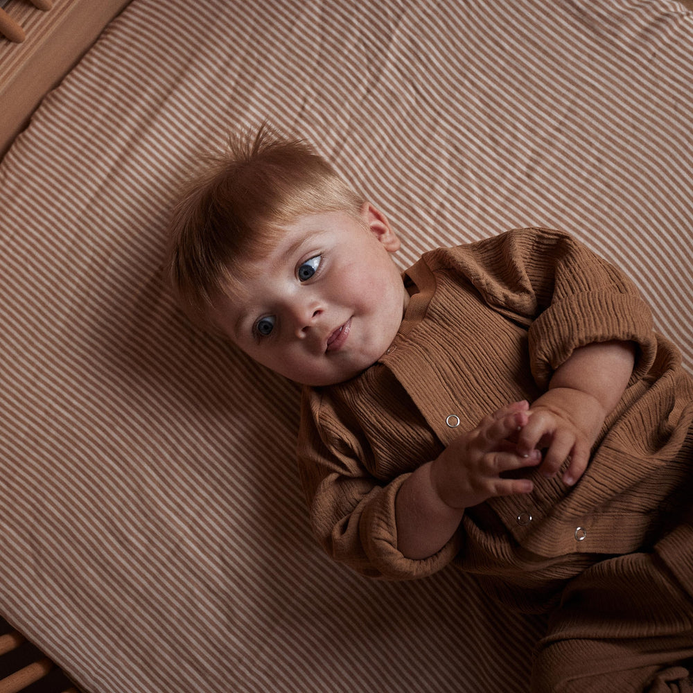 Huxie stripe pattern on a standard 28x52 crib for style.