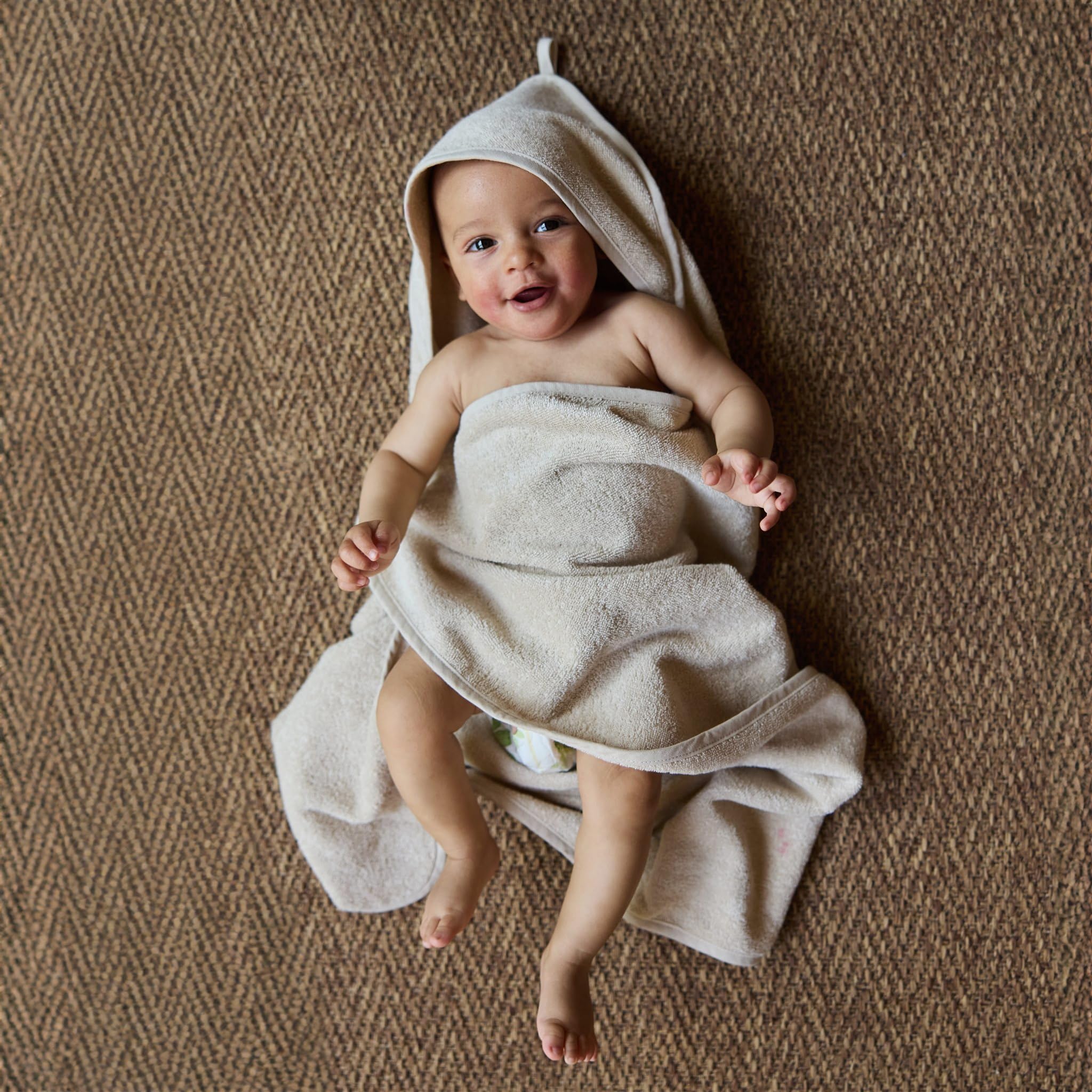 Huxie Hooded Baby Towel 32x32 dimensions ideal for growing babies.