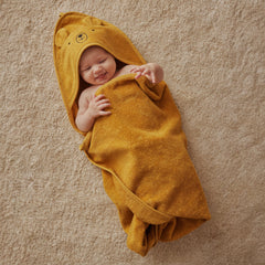 Huxie hooded towel after bath keeps little one warm and dry.