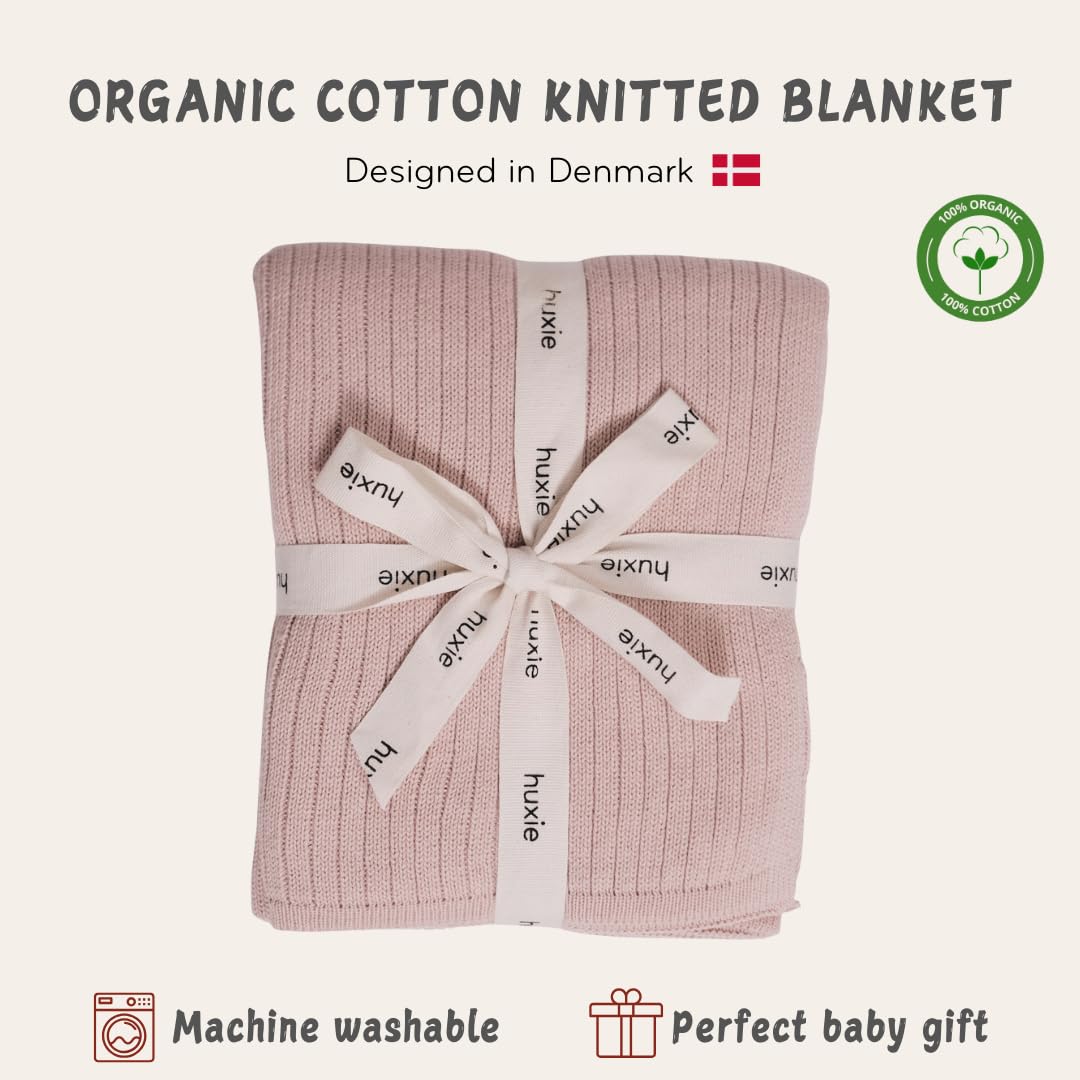 Huxie blanket in stroller use providing on-the-go warmth and comfort.