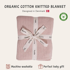 Huxie blanket in stroller use providing on-the-go warmth and comfort.