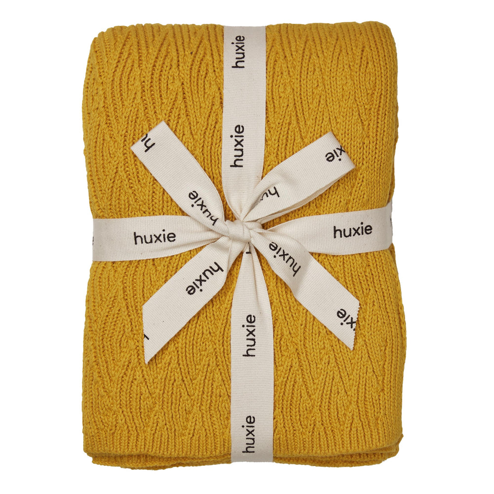 Huxie Knitted Baby Blanket Waves-Yellow close-up texture for gentle newborn skin contact.