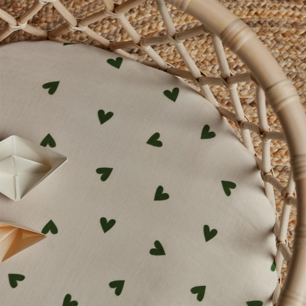 Huxie green hearts design adds charming nursery detail.