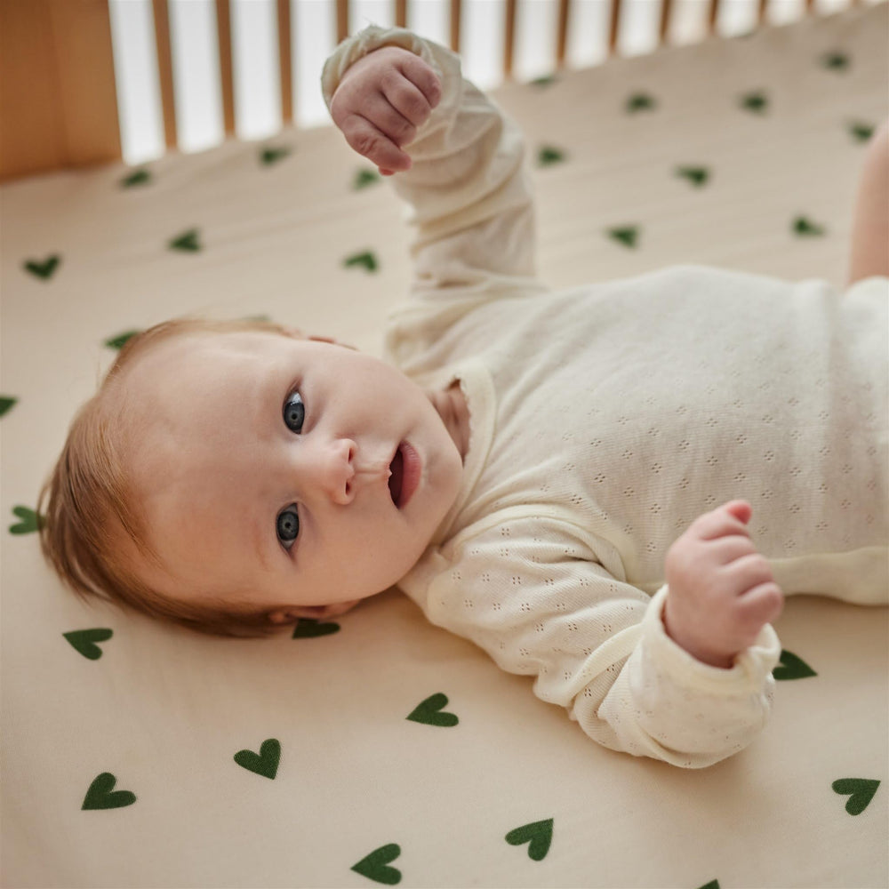 Huxie mini sheet fits pack and play mattresses for travel.