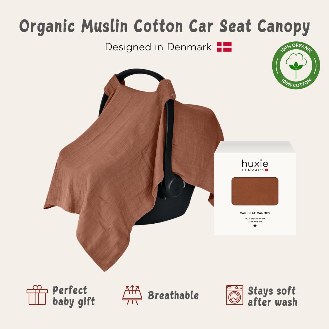 Huxie organic muslin canopy offers breathable comfort for baby during car rides.