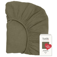 Huxie Sage Green mini crib sheet laid flat showing soft organic cotton texture ideal for newborn sleep