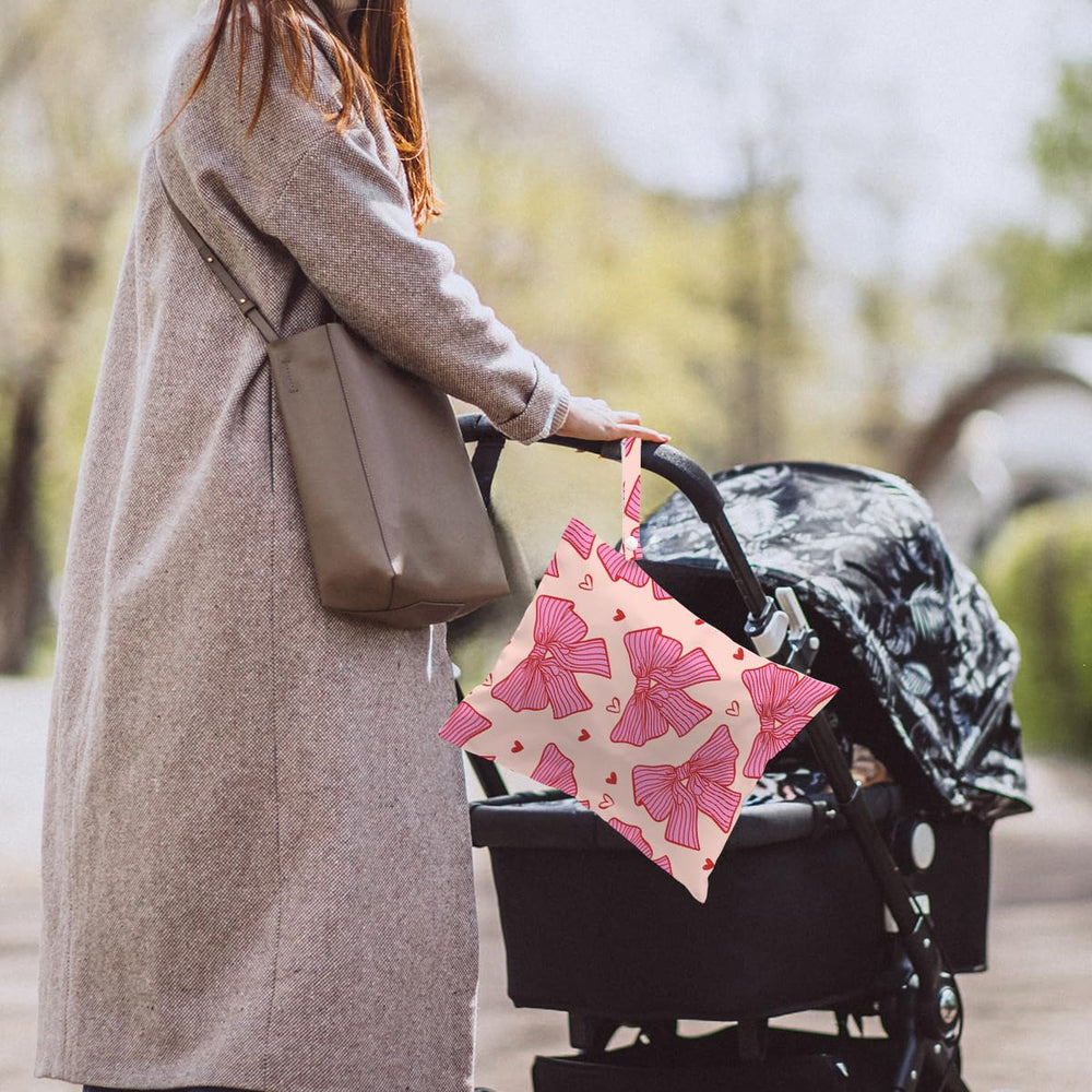 HZMLYDJ Pink Bow Wet Bag waterproof material, quick cleanup after use.