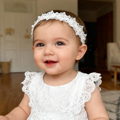 ICKEYOU soft stretchy headband worn on a baby for a gentle fit.