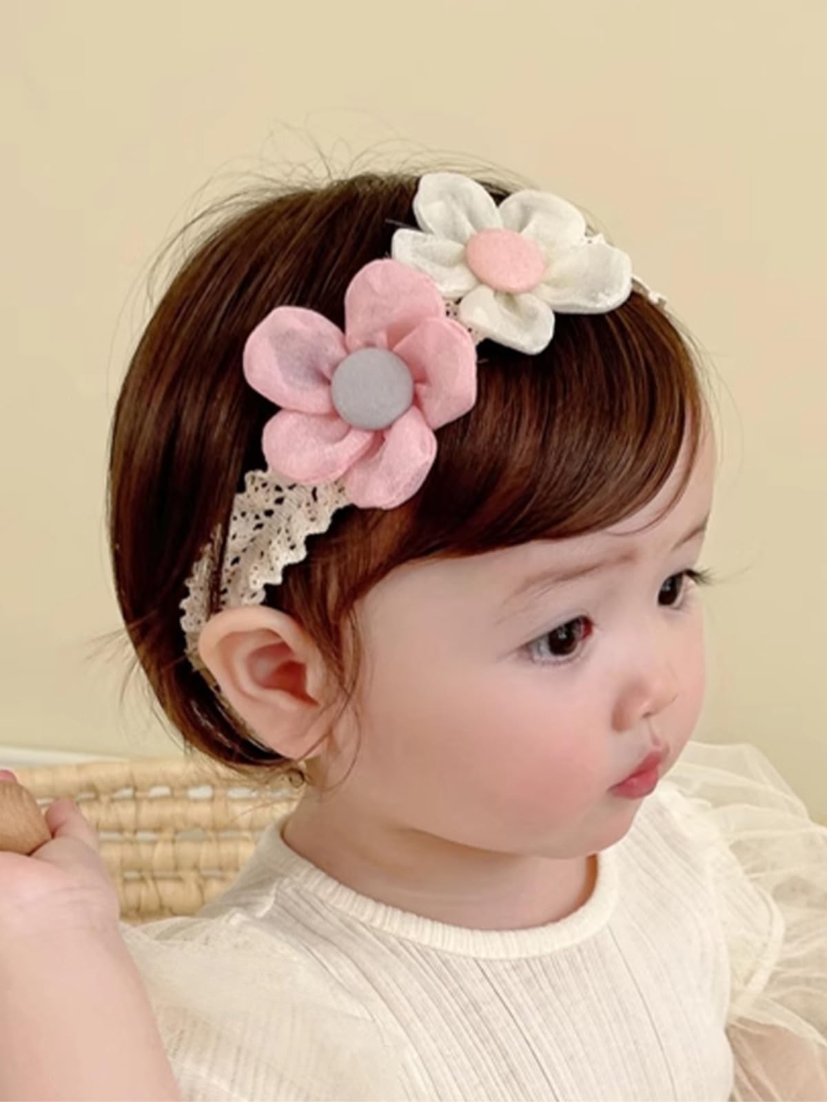 ICKEYOU baby hairband with lace flower in pink and white, secure, gentle on delicate hair.