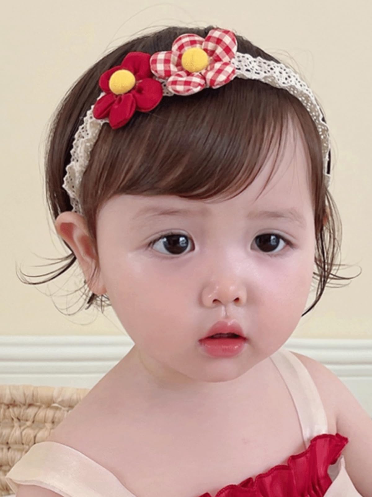 ICKEYOU baby hairband with two red lace flowers provides gentle hold for delicate newborn hair.