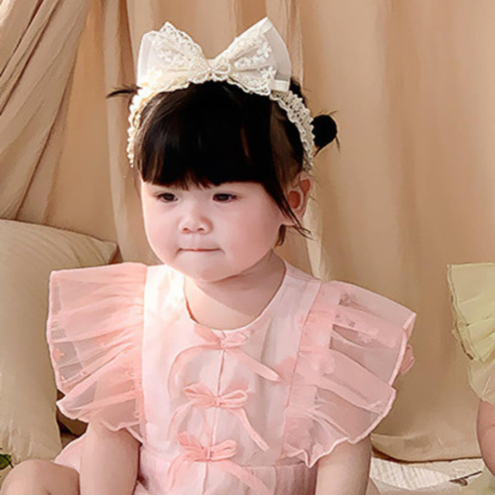 ICKEYOU embroidered pearl bow headband adds charm to newborn outfits.