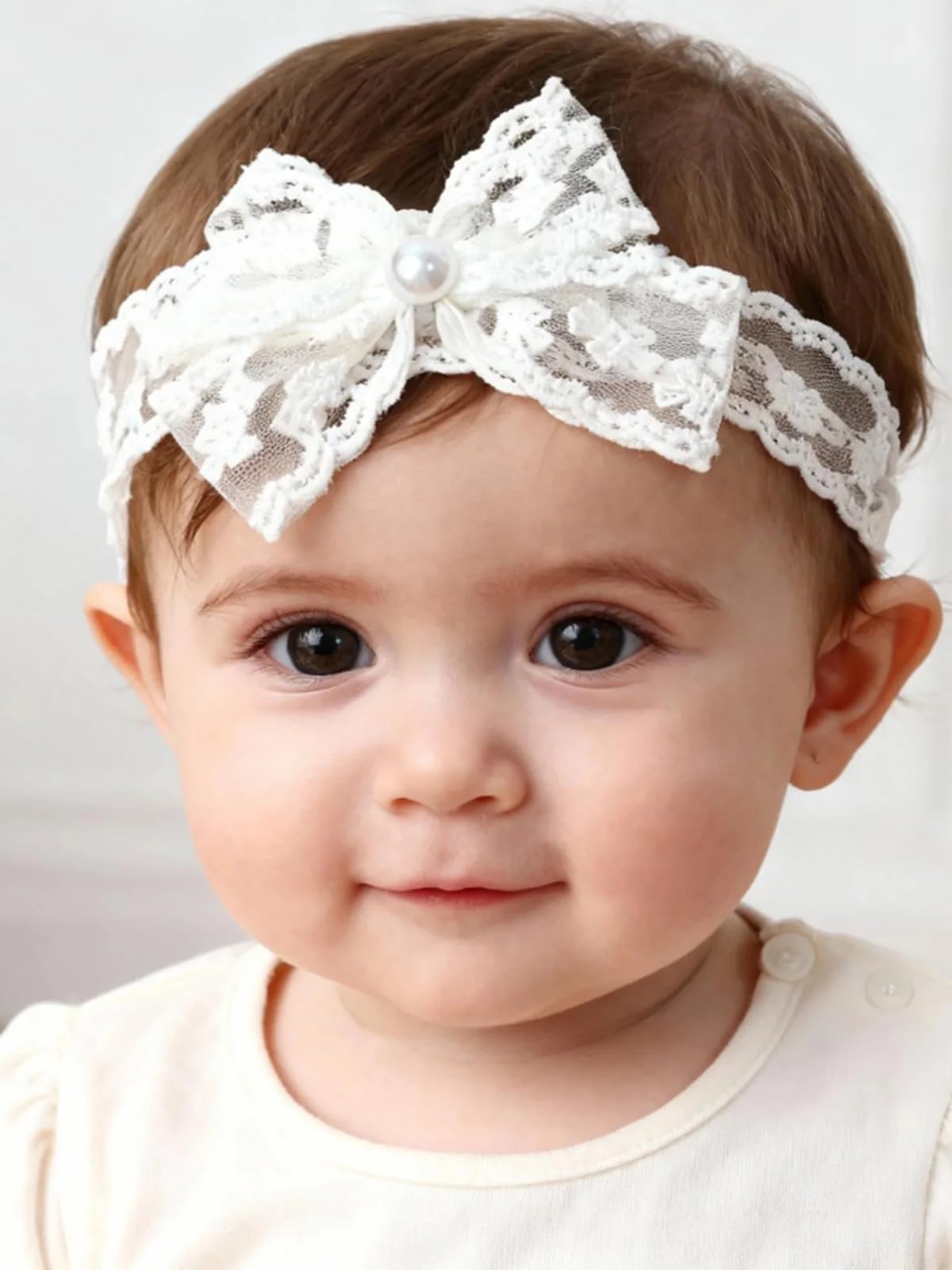 ICKEYOU Pearl Lace Bow Headband with a soft elastic design for delicate babies and photos.