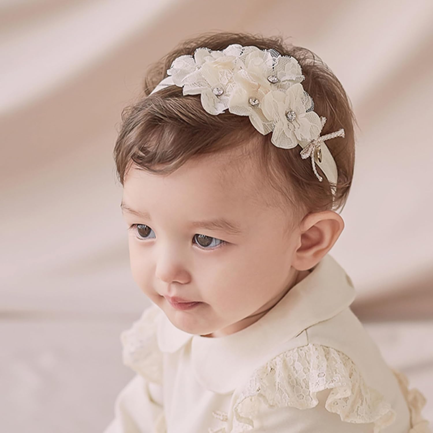 ICKEYOU pearl-embellished lace headband in beige flowers adds timeless charm for photos.