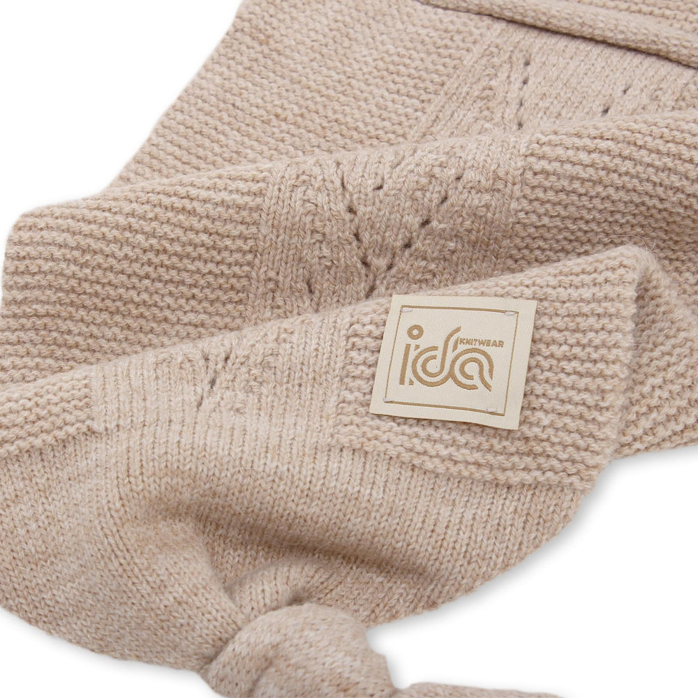 IDA KNITWEAR Cocoon Baby Blanket stone wrap demonstrates snug cocoon for calm newborns.