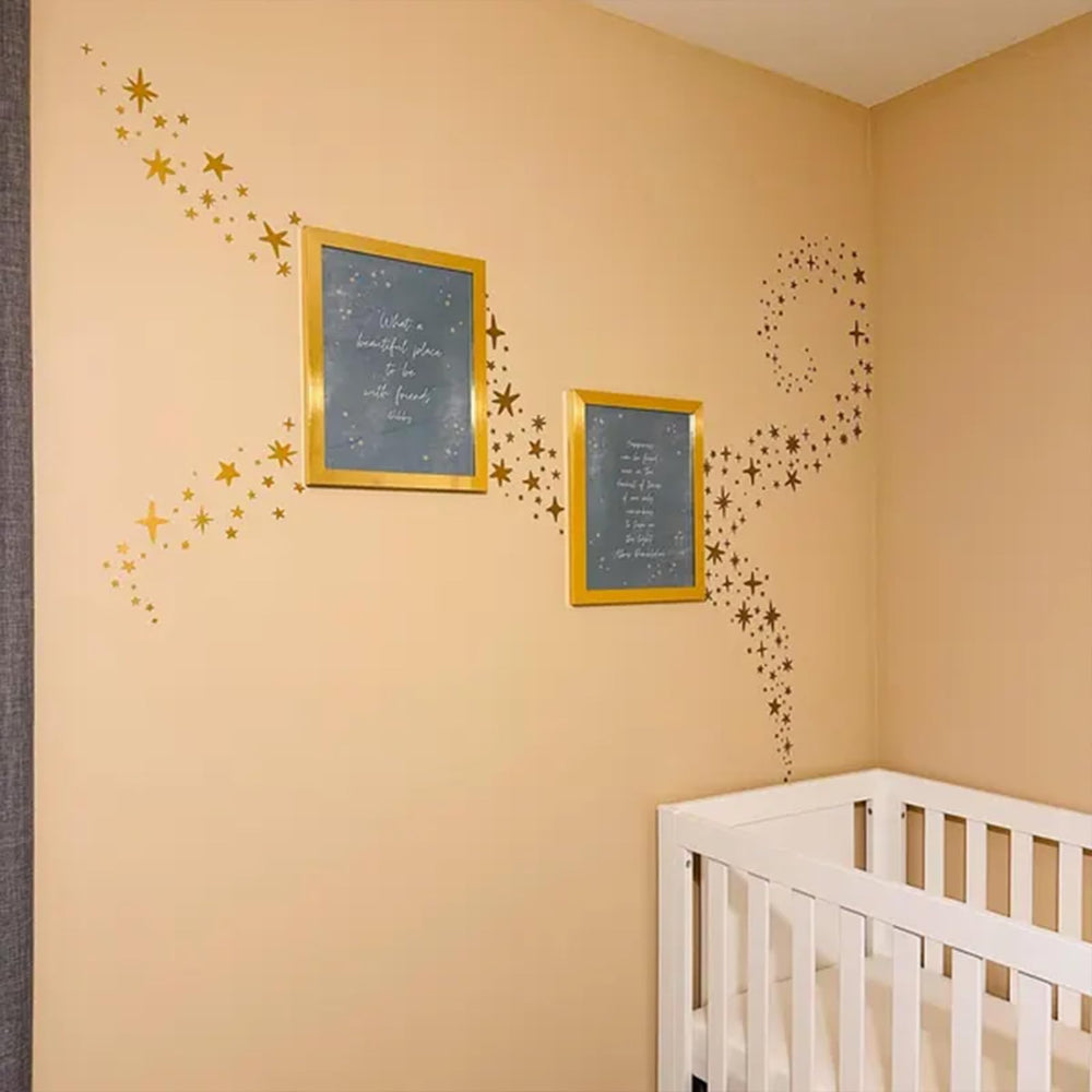 iinuu golden stars varied sizes form a playful celestial pattern