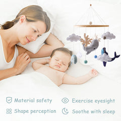 Ikubigu Montessori baby mobile white clouds adds gentle ceiling decor for bedtime.