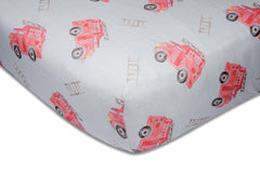 Immispace fire truck crib sheet on a standard crib for newborn comfort.