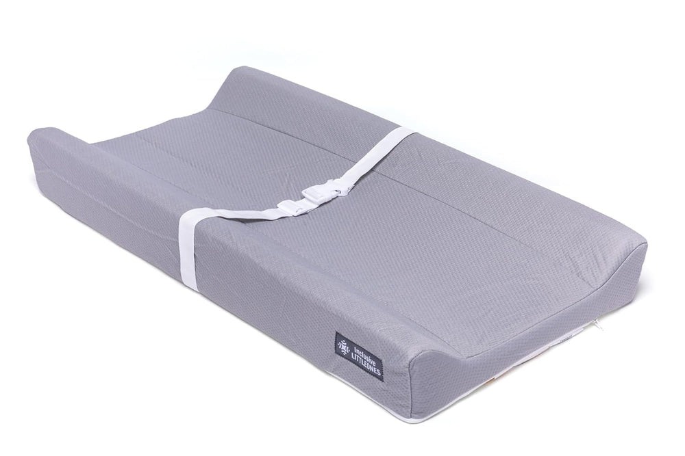 Inclusive LittleOnes changing pad with contoured edges for safe diaper changes at home or travel.