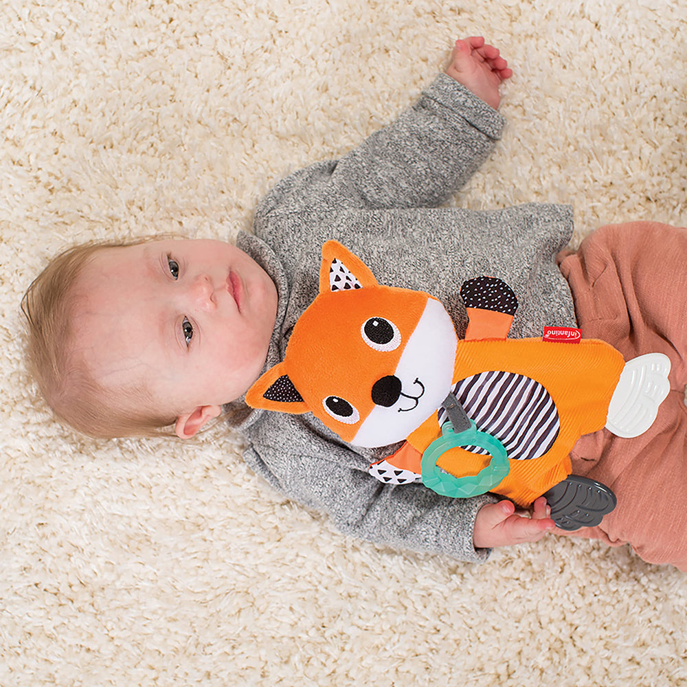 Infantino Cuddly Teether Fox crinkles to spark sensory exploration.