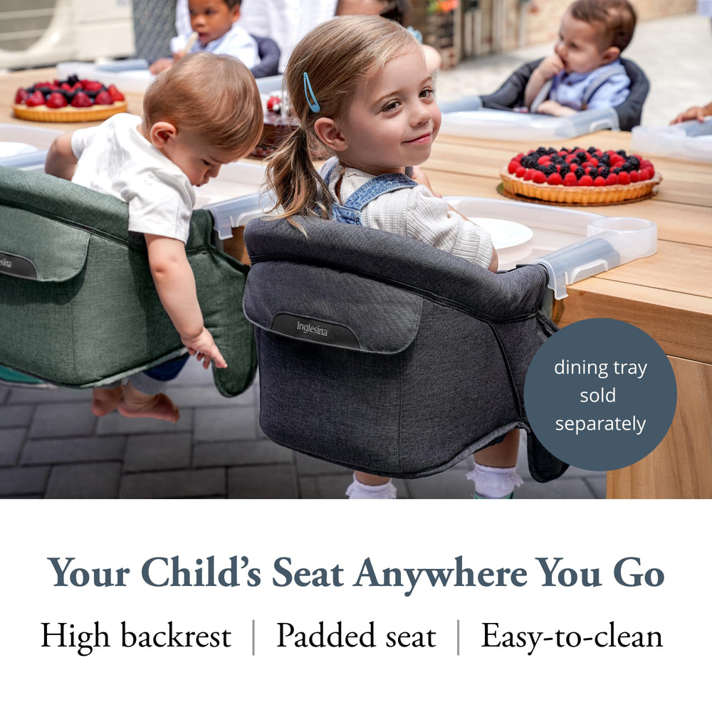 Inglesina Fast Table Chair attached to a table for stable dining.