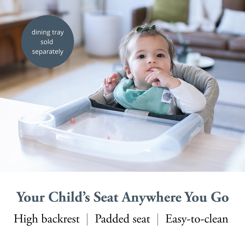Inglesina Fast Table Chair Cream attached to a table for secure seating.