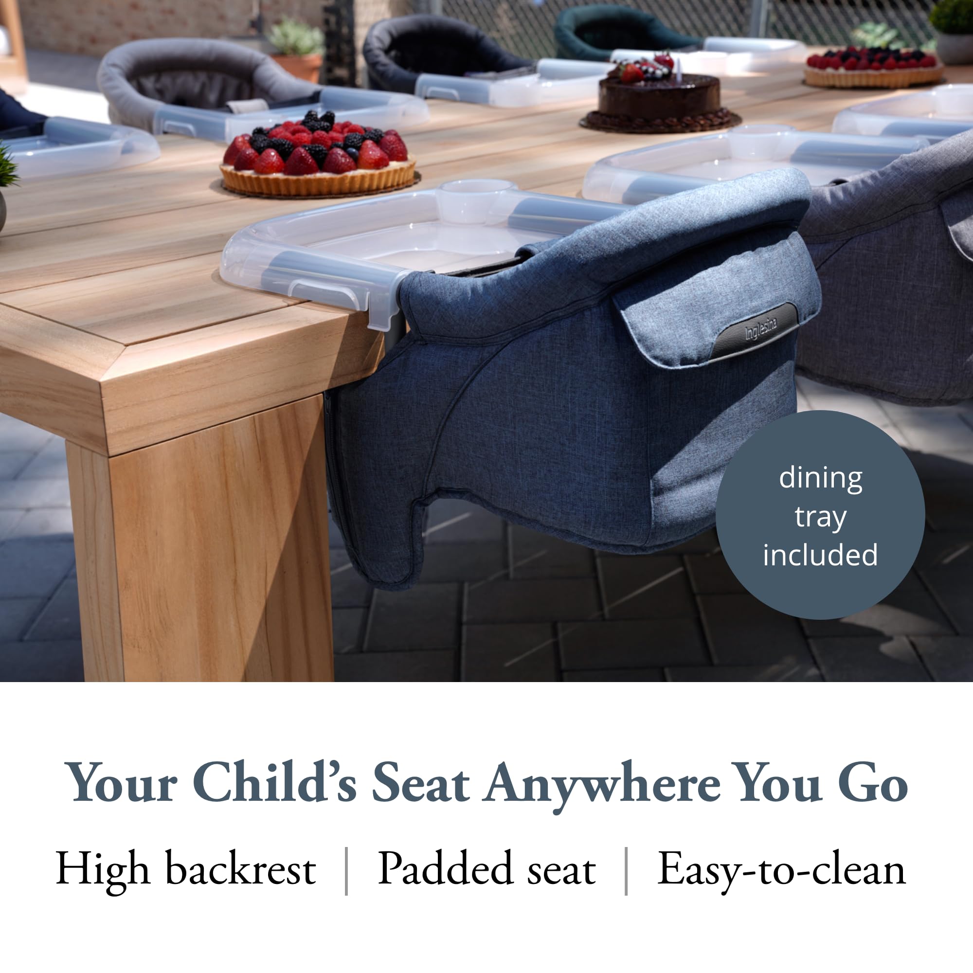 Dining tray attached to Inglesina Fast Table Chair for spill prevention during feeding.