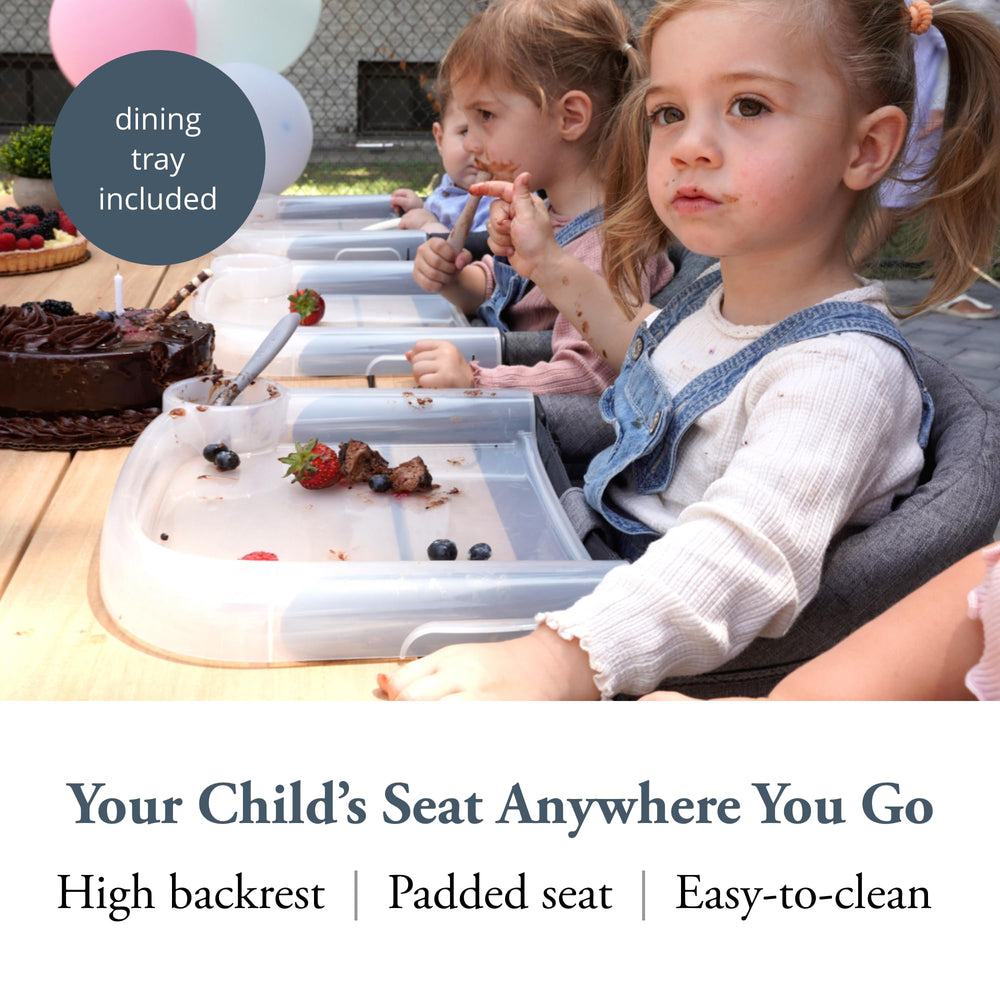 Dining tray attached to Inglesina chair for tidy, spill-resistant meals.