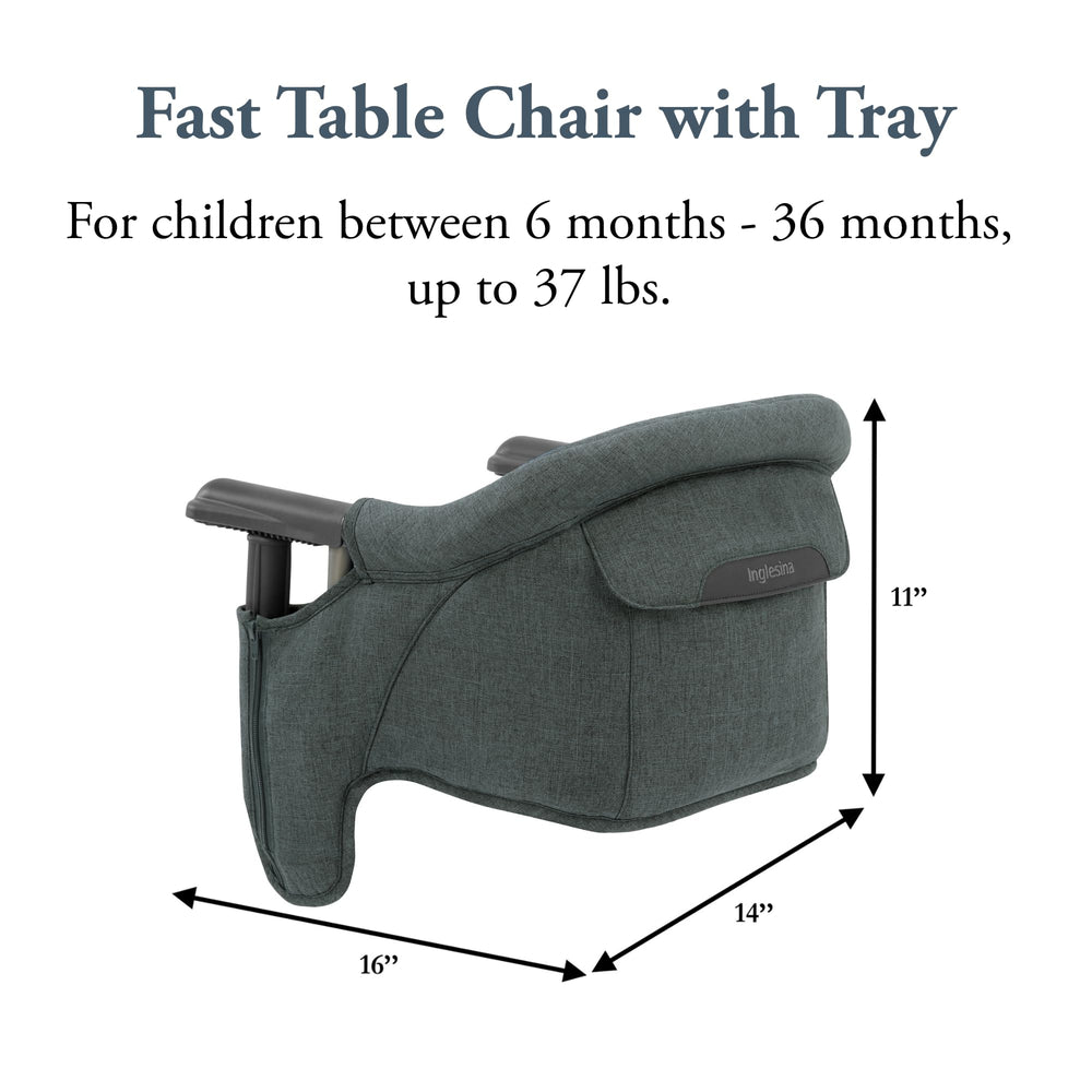 Baby using Inglesina Fast Table Chair at mealtime in a restaurant