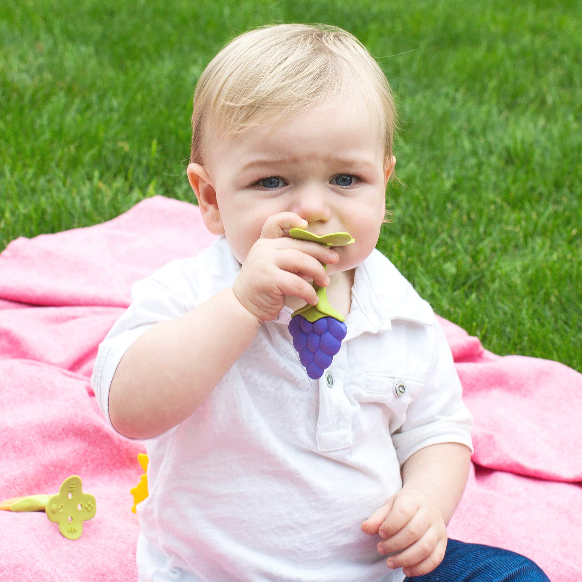Baby enjoying slow chewing with Innobaby teether supporting oral development.