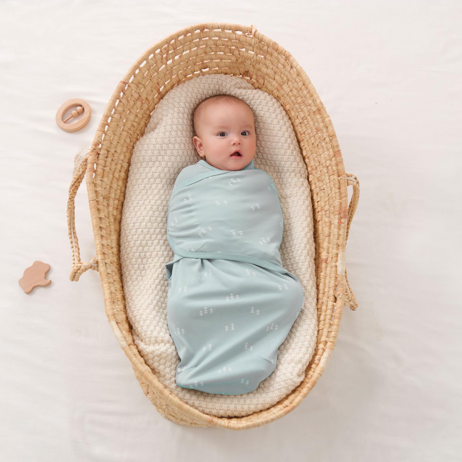 Insular Baby Swaddle Wrap Beige Swan nursery setup with calm sleeping baby