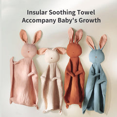 Insular Bunny Lovey in baby's hand demonstrates easy grasp and comforting size.