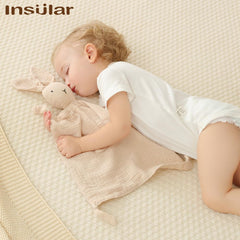 Insular soft-lovie closeup shows plush texture and embroidered eyes for safety.