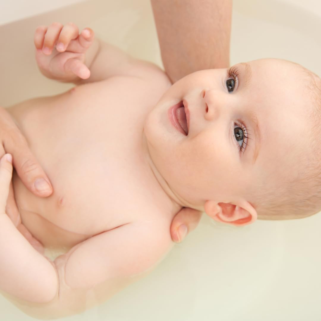 Irene Organics Oatmeal Bath Powder in tub scene, suitable for baby and toddler skin.