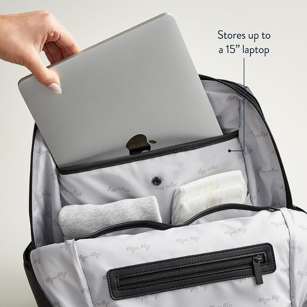 Itzy Ritzy Eras diaper bag laptop compartment fits up to 15-inch device.