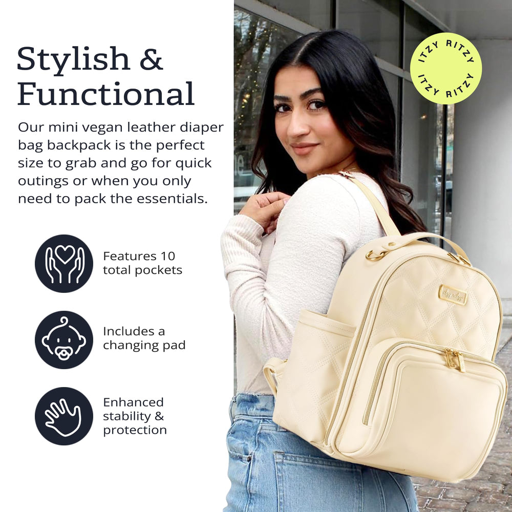 Itzy Ritzy Mini Plus Backpack parent pocket with key lanyard for essentials access.