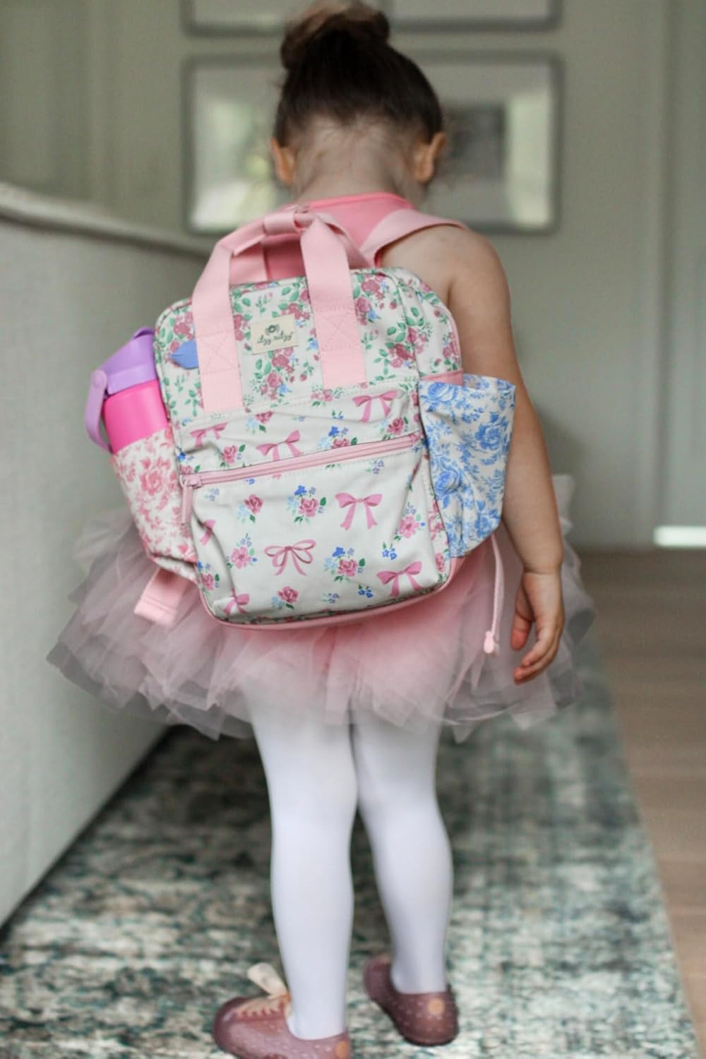 Side view of water bottle pocket on Itzy Ritzy toddler backpack.