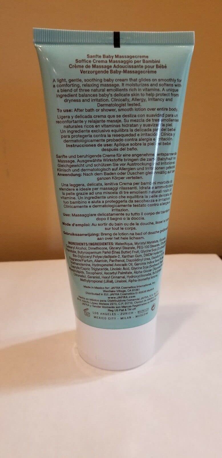 Application on baby's arm using Tender Moments Massage Cream for soothing care.
